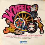 Cover for album: John Carter (24), Mary Kay Beall, Warren Barker – Wheels: A Musical About The World's Greatest Invention(LP, Album)