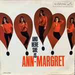 Cover for album: Lovie JoeAnn-Margret – And Here She Is(LP, Album, Mono)