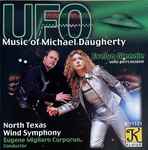 Cover for album: Michael Daugherty, Evelyn Glennie, North Texas Wind Symphony, Eugene Migliaro Corporon – UFO: Music Of Michael Daugherty(CD, Album, Stereo)